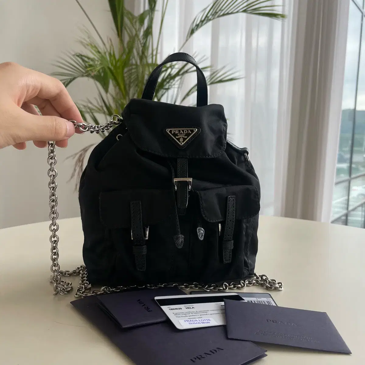 Prada vela mini backpack with chain deals